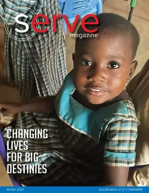 A little girl is on the cover of a serve magazine