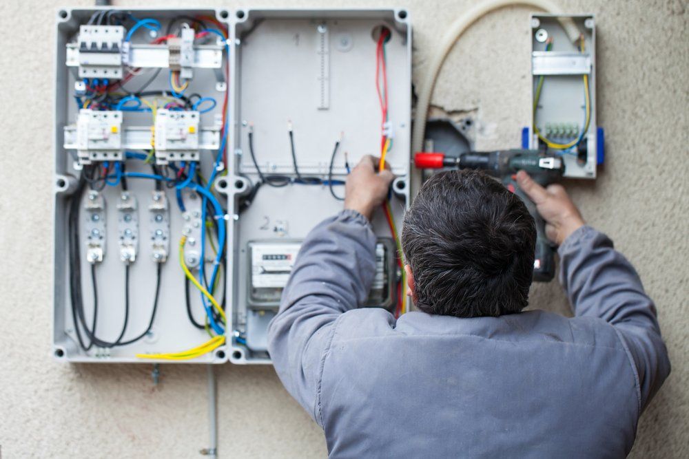Man Working On Fuse Box