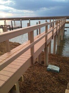Light Brown Deck Near Seashore - Decking Services in Wyncote, PA
