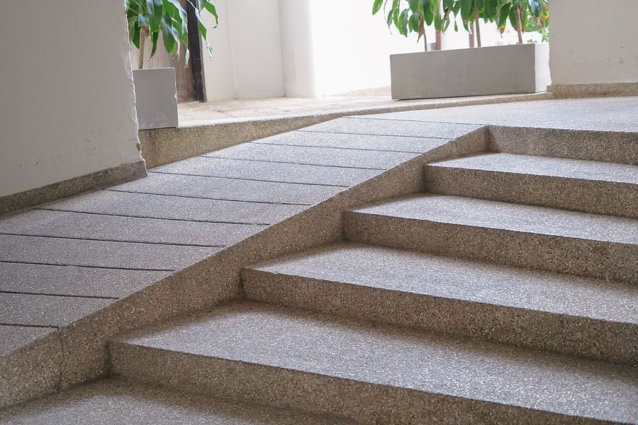 A set of stairs with a ramp in the background