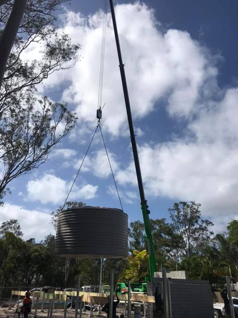 Crane Lifting Tank — F & M Plumbers & Drainers In Kunda Park QLD
