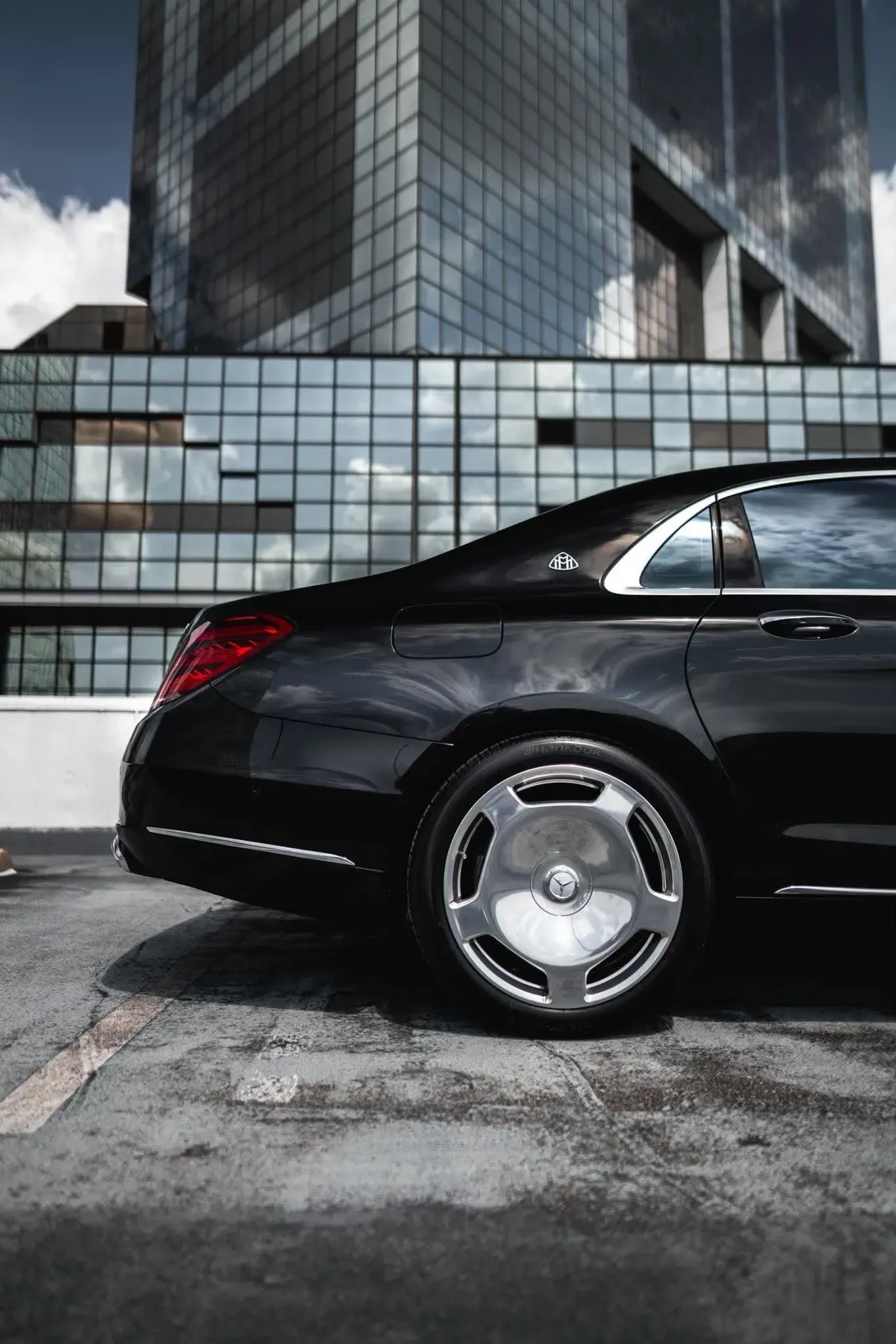 Luxury black sedan waiting at the New Orleans airport curb