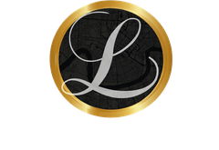 A silver cursive letter