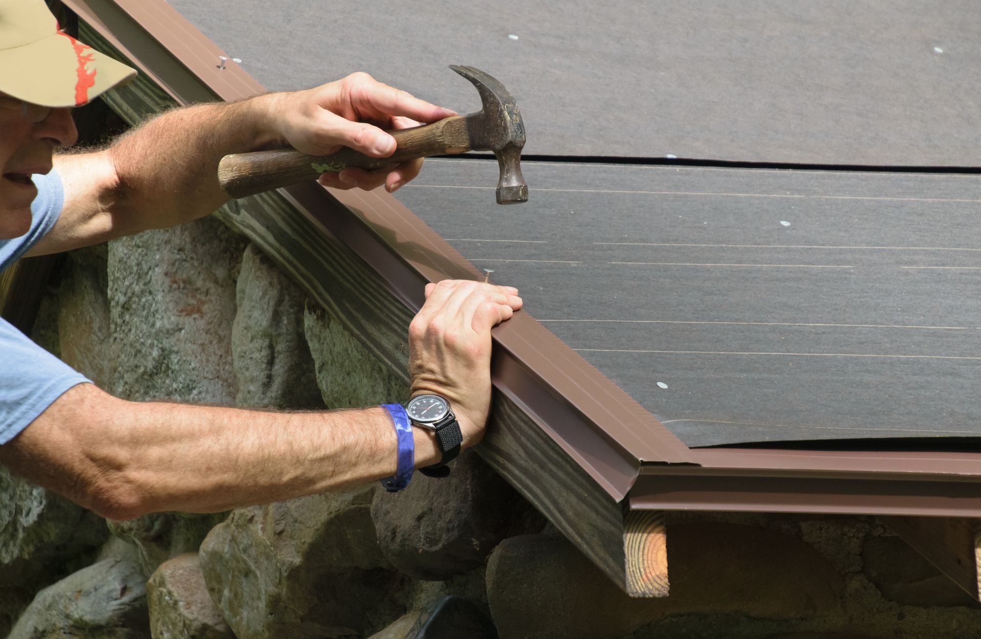 An unrecognized roofing contractor is installing a new roof on a house.