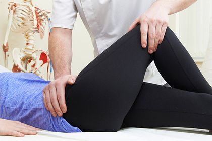 Patient receiving osteo leg massage and treatment