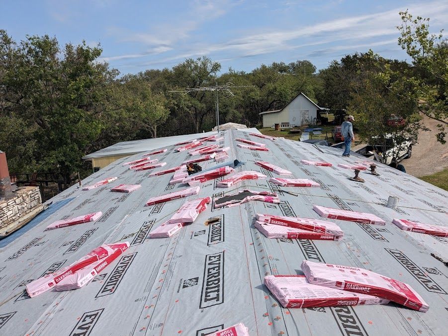 A roof with a lot of roofing material on it