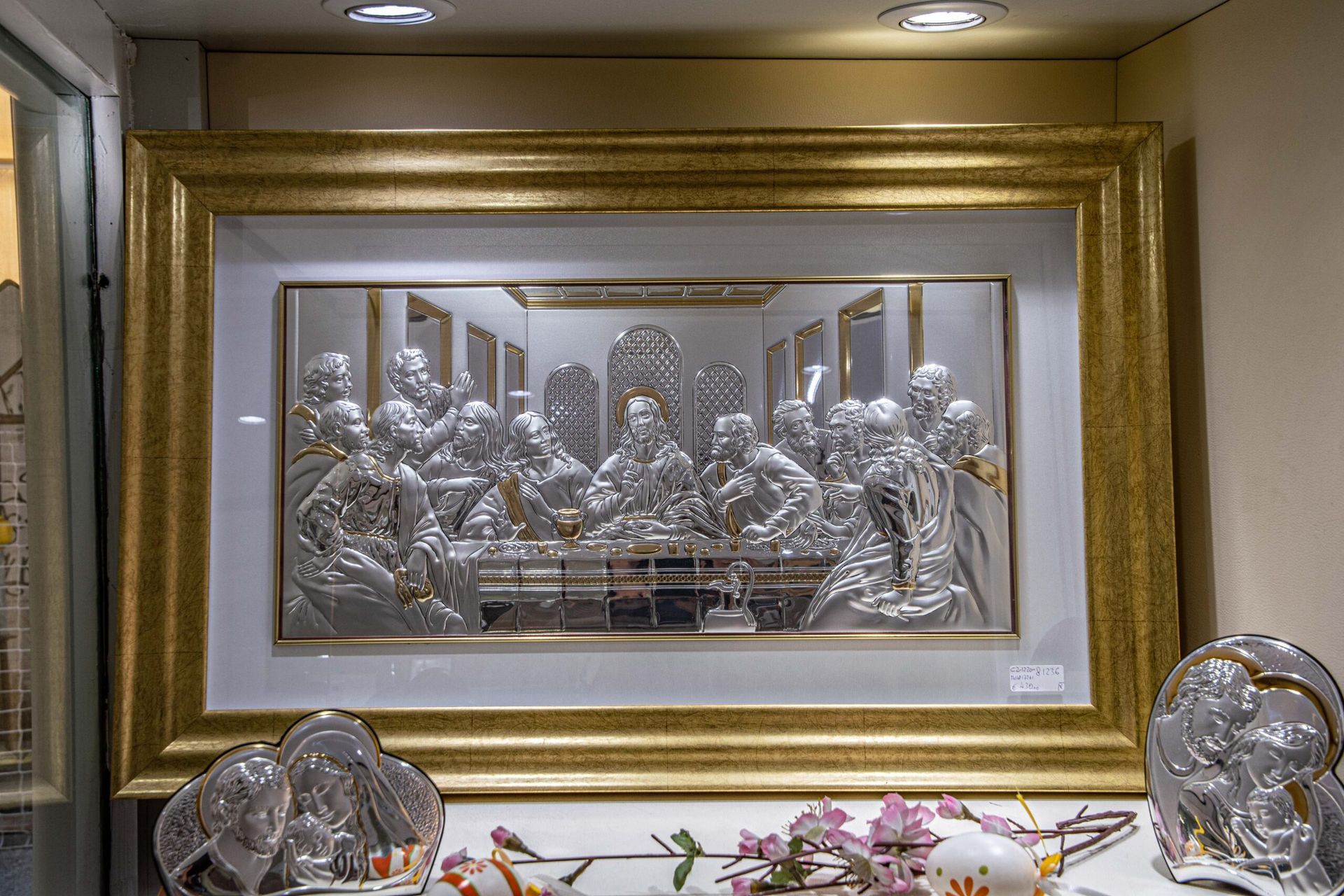 Immagine dell'Ultima Cena in cornice dorata.