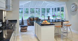A kitchen leading out to a conservatory