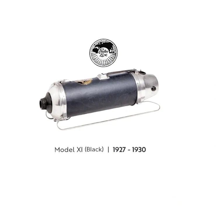 A vintage cylindrical black vacuum cleaner with chrome ends, labeled 