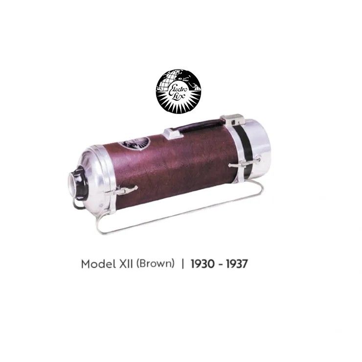 A brown, vintage canister-style vacuum cleaner, the Model XII (1930-1937), with a metallic handle and base.