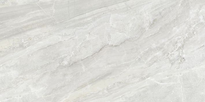 A textured beige surface featuring a subtle, light-colored mottled marble pattern.