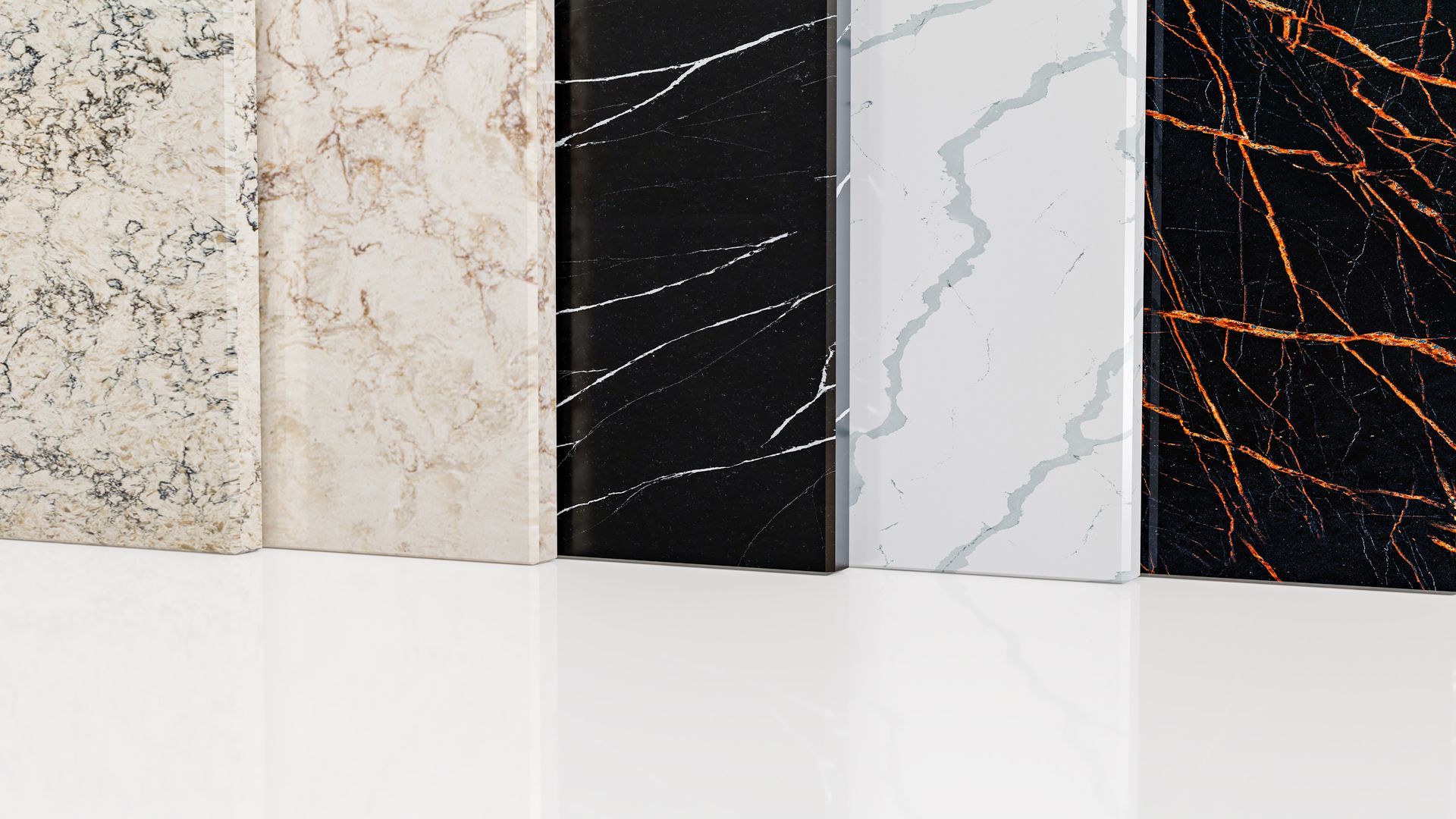 Five upright slabs of various marble and quartz patterns, ranging from speckled beige to white and black with veining.