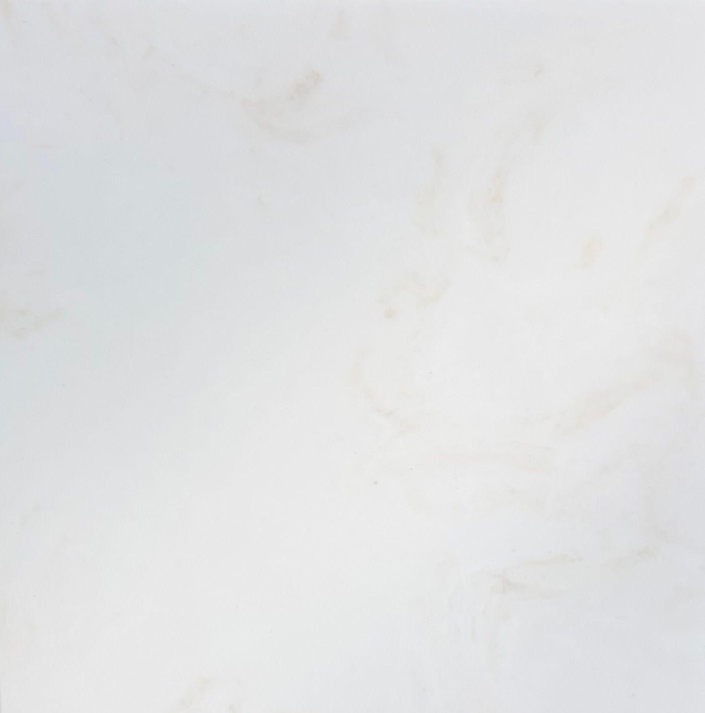 A close-up, top-down view of a textured dark gray stone surface with subtle white and green mineral veining throughout.