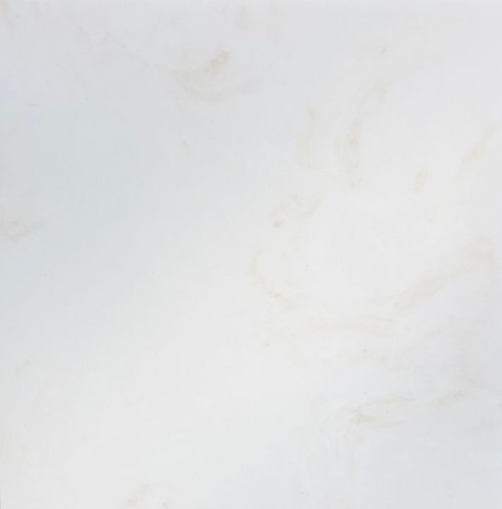 A close-up, top-down view of a textured dark gray stone surface with subtle white and green mineral veining throughout.