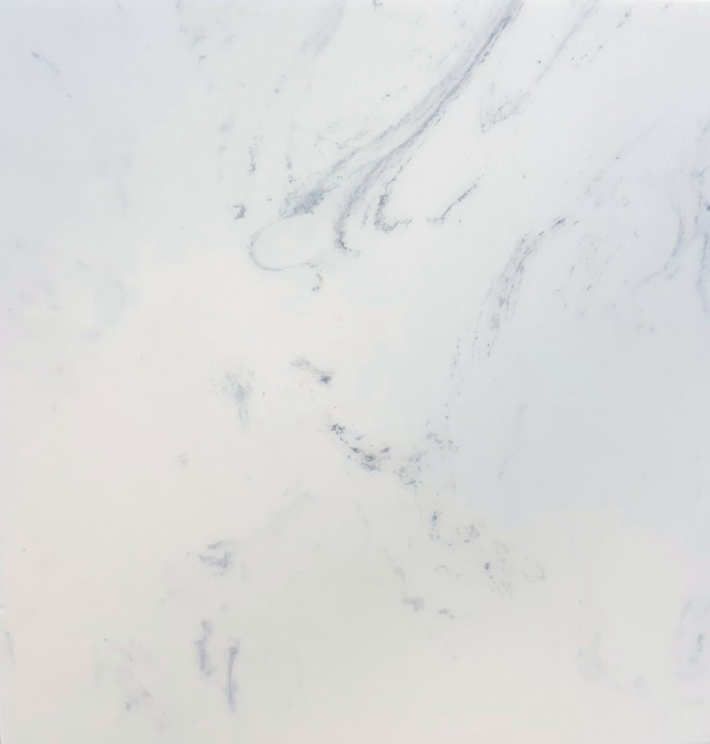 A texture of white marble stone with subtle grey veining running diagonally across the surface.