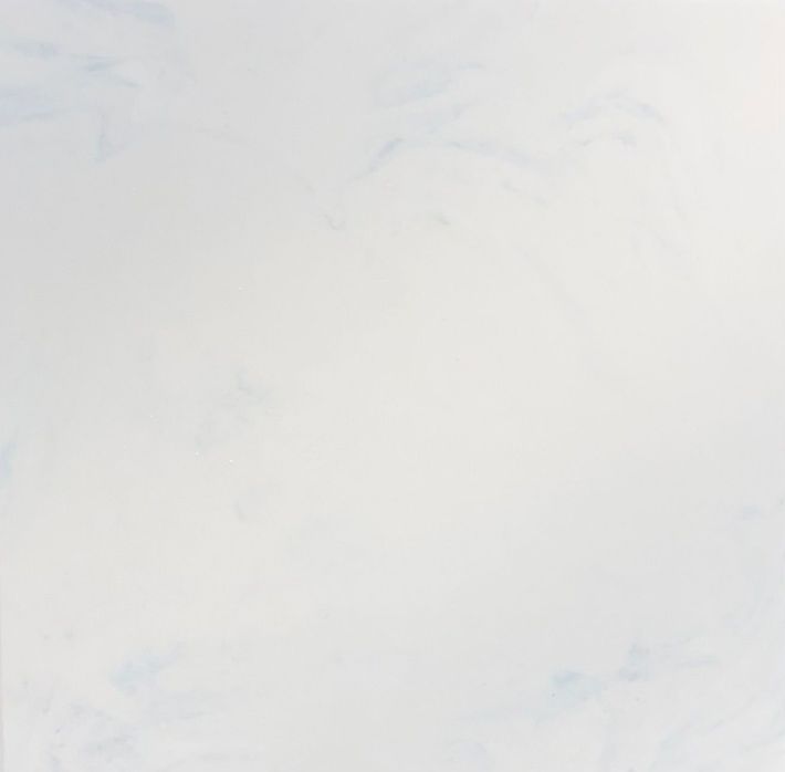 A texture of white marble stone with subtle grey veining running diagonally across the surface.