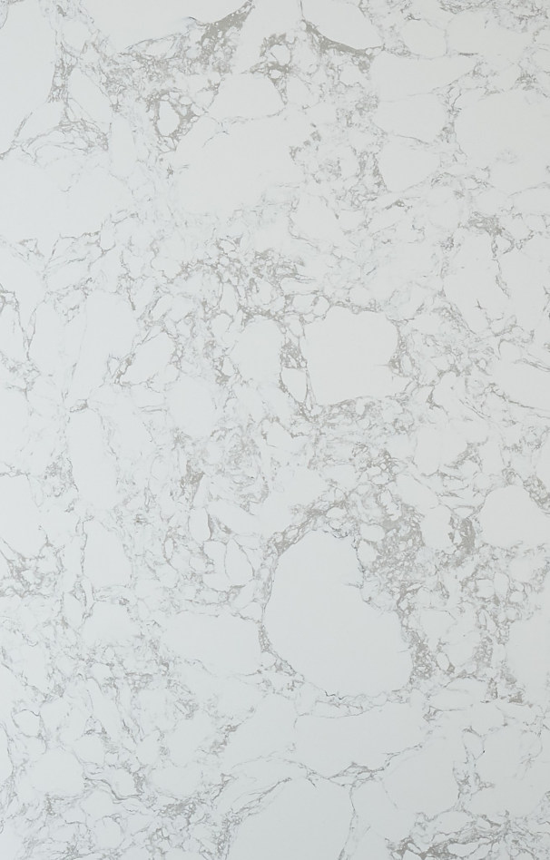 A texture of white marble stone with subtle grey veining running diagonally across the surface.