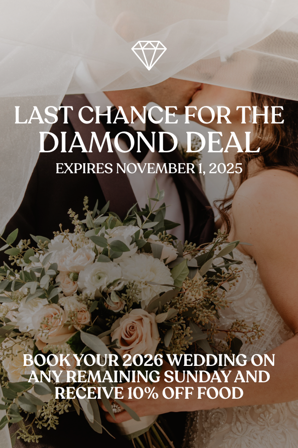 A couple who have just gotten married are kissing.