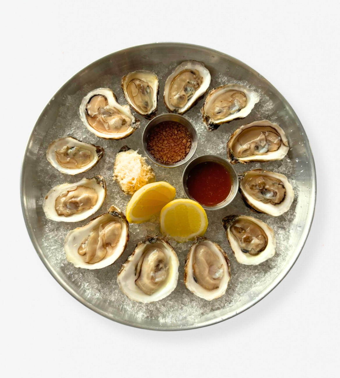 East Coast Oysters on a white tablecloth-covered table. 