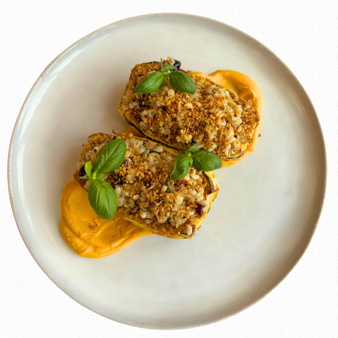 A plate of Stuffed Delicata Squash. 