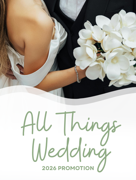 A couple who just got married, holding hands and showing off their new rings. 