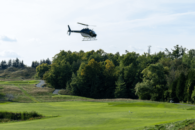 Helicopter flying over the course
