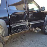 Body Work — Man Spraying A Car Paint in Redlands, CA
