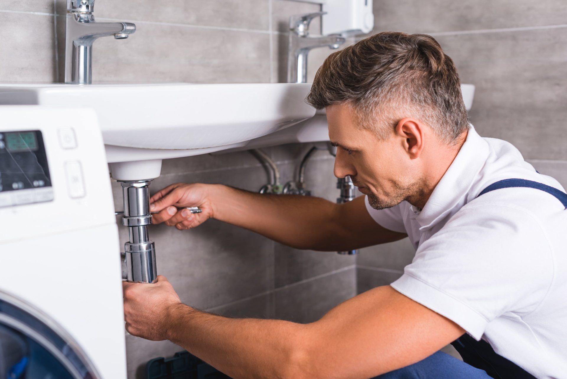 Plumber Fixing Bathroom Sink — Seguin, TX — A1 Tri-County Plumbing