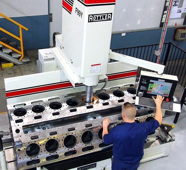 Man Working on the Machine — Brisbane, QLD — Mendham Engineering Pty Ltd
