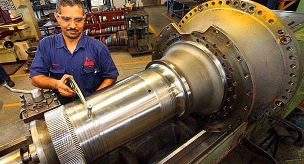 Man Working on the Steel Machine — Brisbane, QLD — Mendham Engineering Pty Ltd