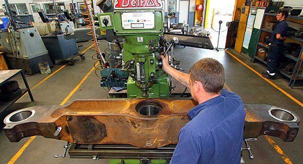 Man Working on the Factory — Brisbane, QLD — Mendham Engineering Pty Ltd