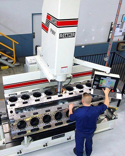 Man Working on the Machine — Brisbane, QLD — Mendham Engineering Pty Ltd