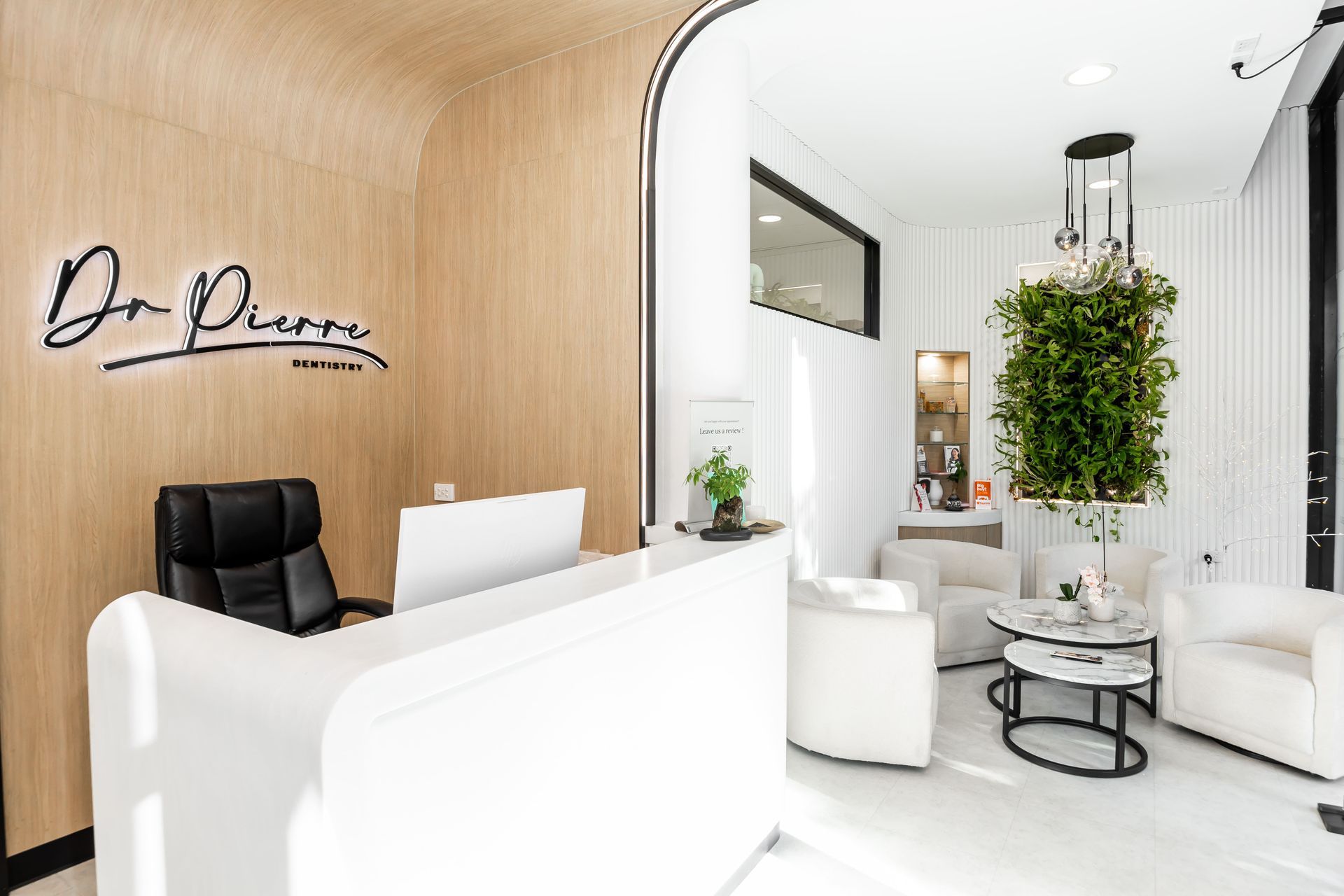 A dental reception desk in the middle of the room.