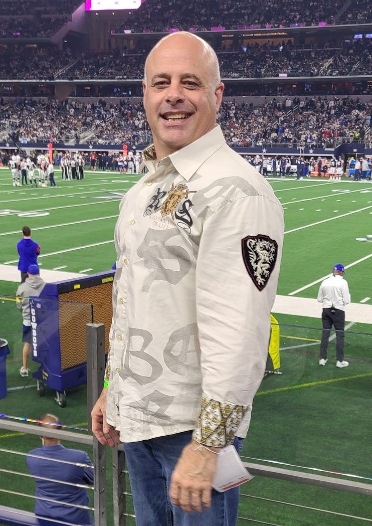 Craig Callaway, owner of Tumble and Stunt Institute, at a football game