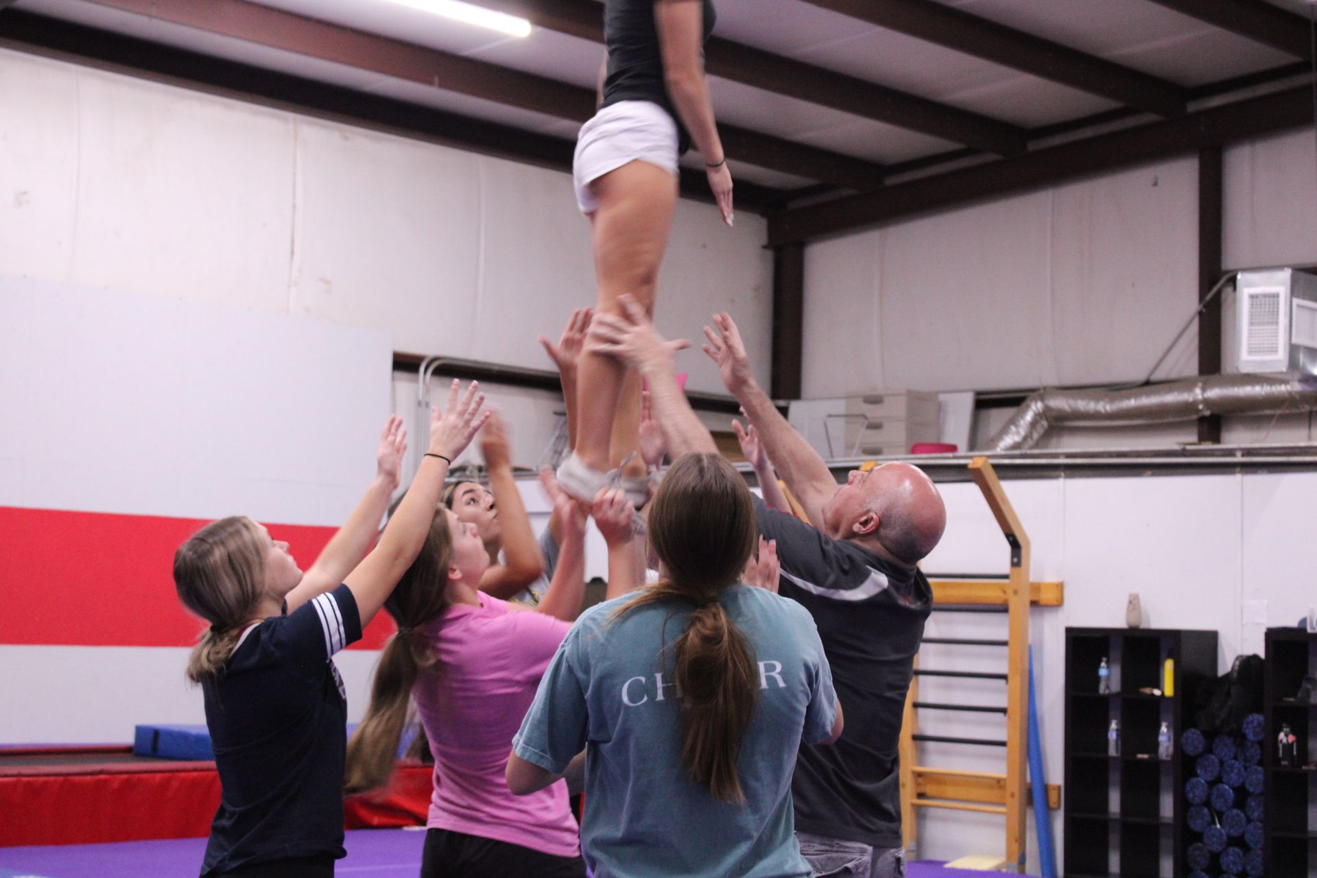 Group of students practicing a stunt with owner Craig Callaway