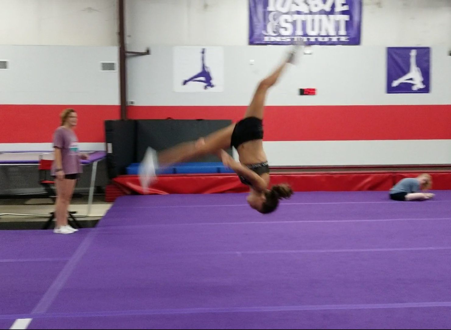 Tumble and Stunt Student demonstrating an Aerial