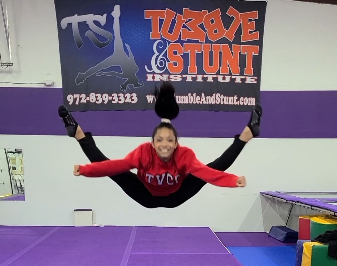 Tumble and Stunt Student demonstrating a Toe Touch