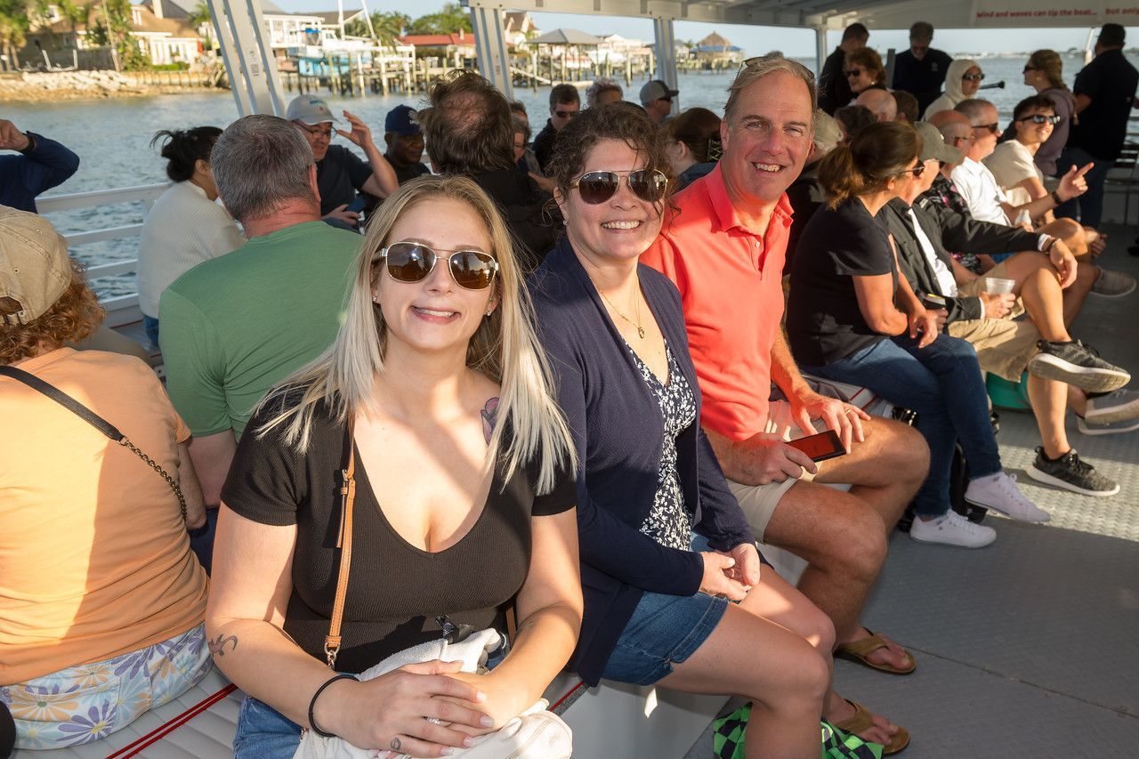 A group of people are sitting on a boat.