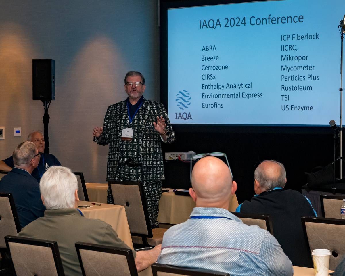 A man is giving a presentation to a group of people at a conference.