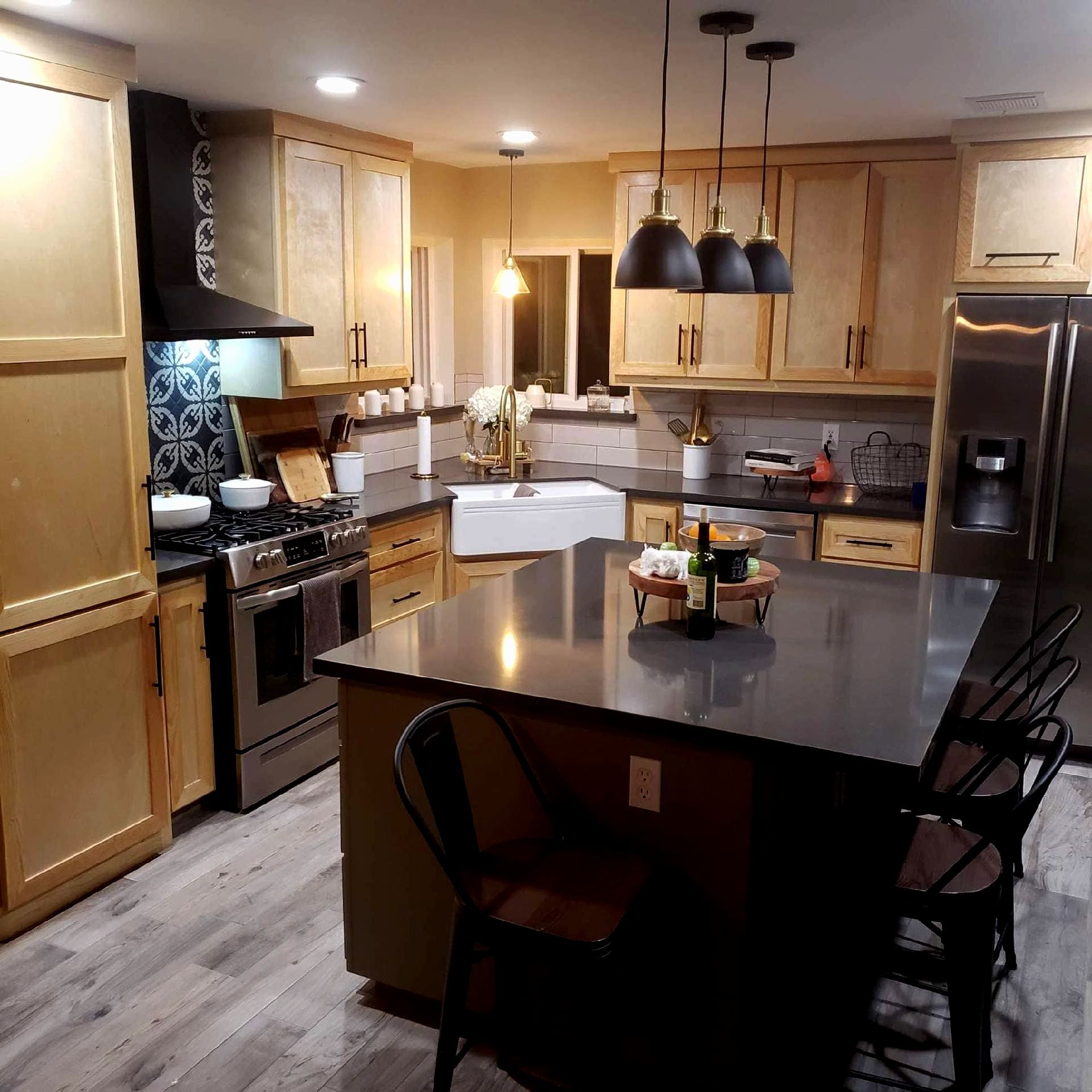 A kitchen with stainless steel appliances and wooden cabinets