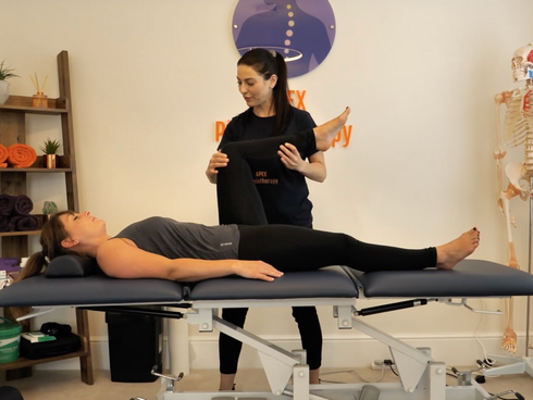 Bahrak from APEX Physiotherapy providing treatment to a patient on a physio couch