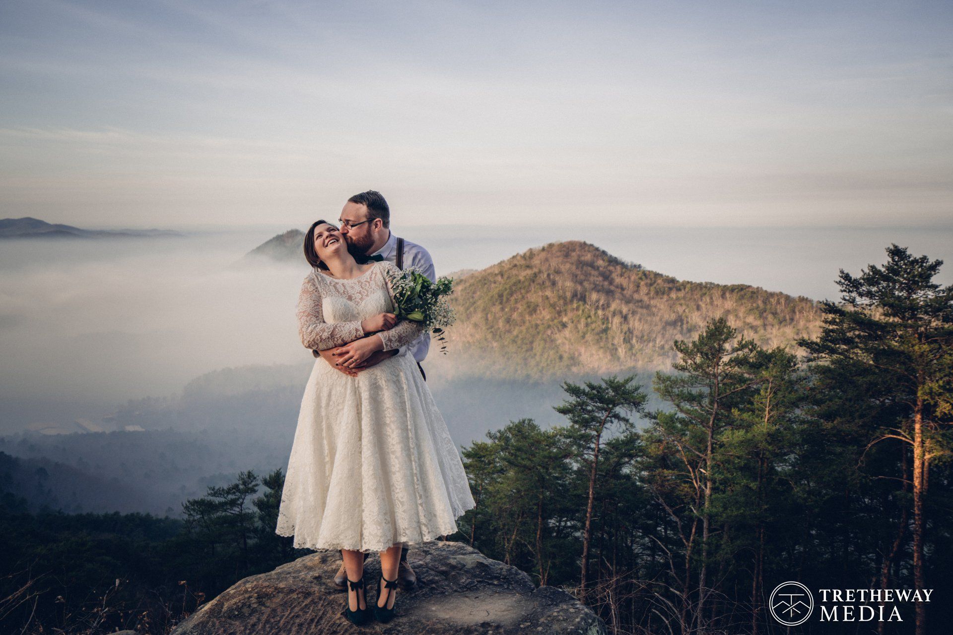 Groom kissing his bride on the cheek at Chilhowee, Chattanooga Wedding Photographer