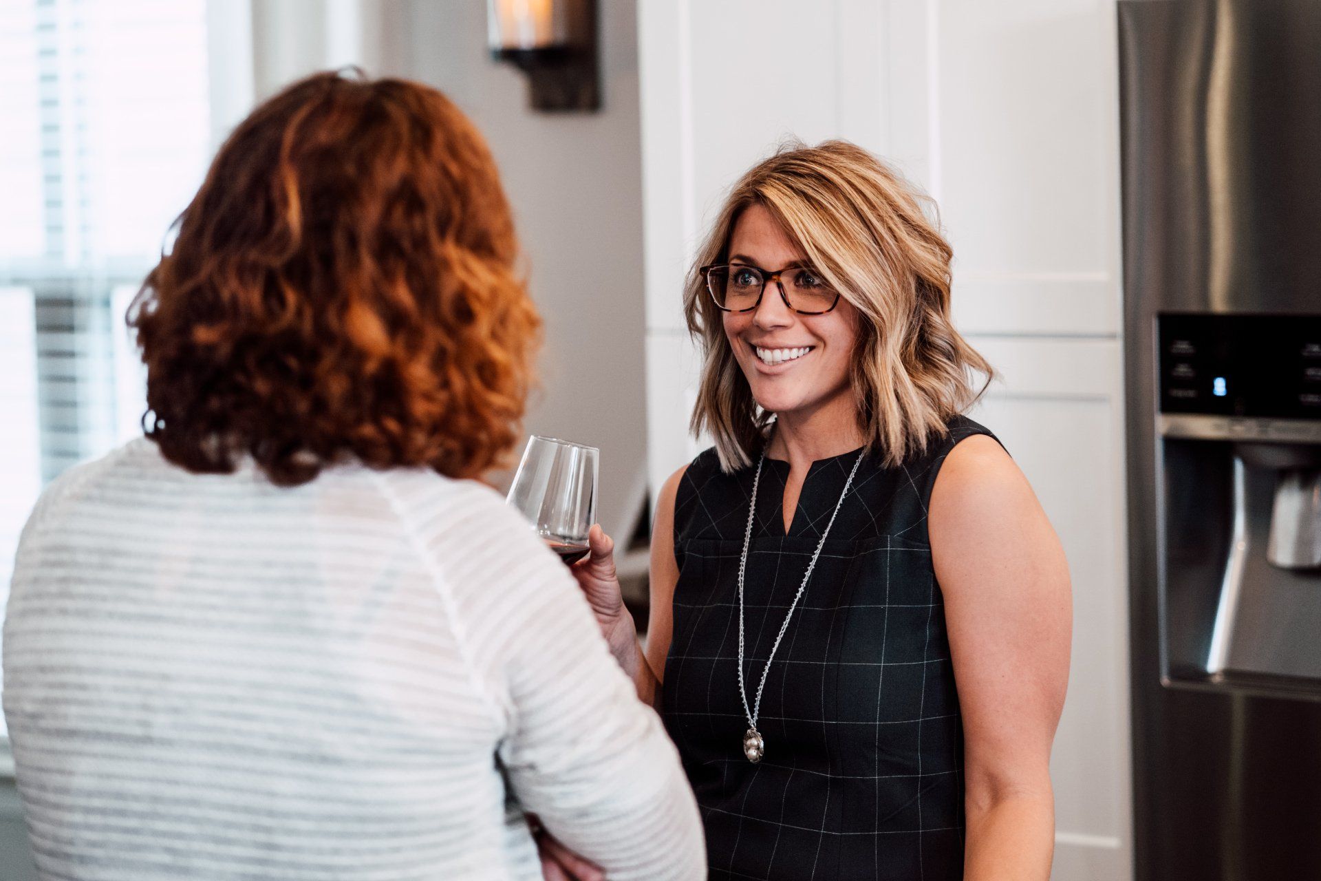 Two ladies chatting at an event