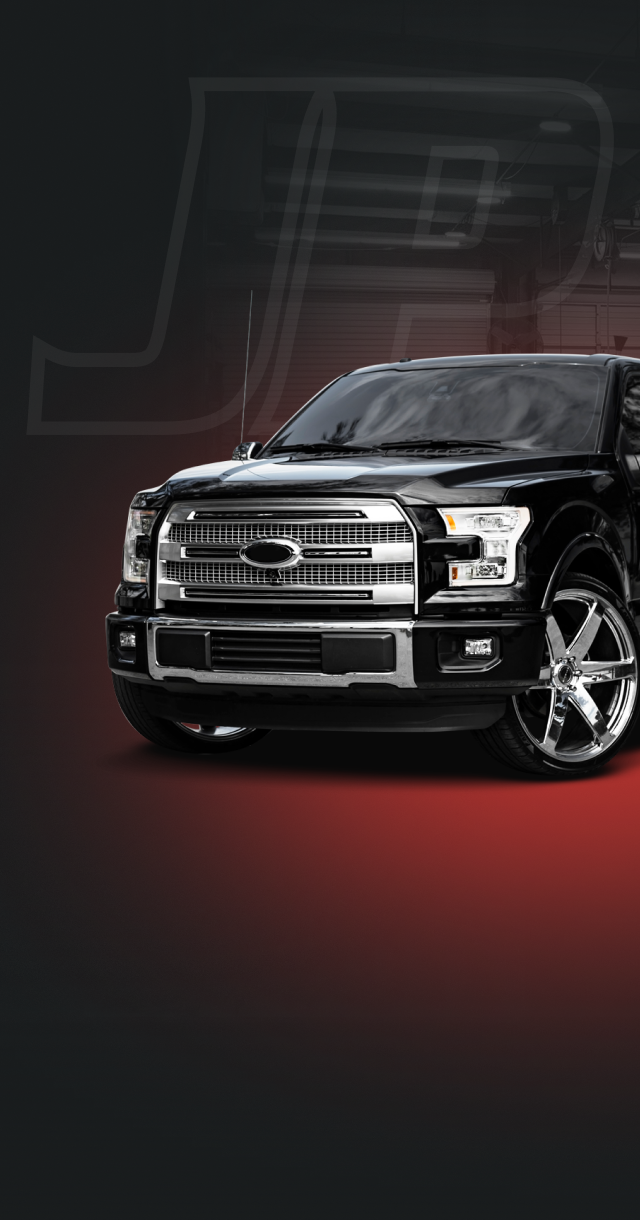 Black Truck in front of black and gray background | JP Automotive & Repair LLC