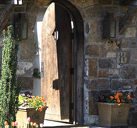 Stone doorway with open wooden door