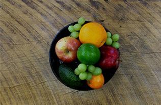 Fruit in a black bowl