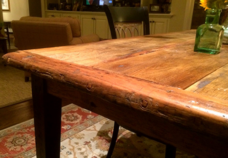 Rustic wooden table, close-up. Brown surface with natural wood grain