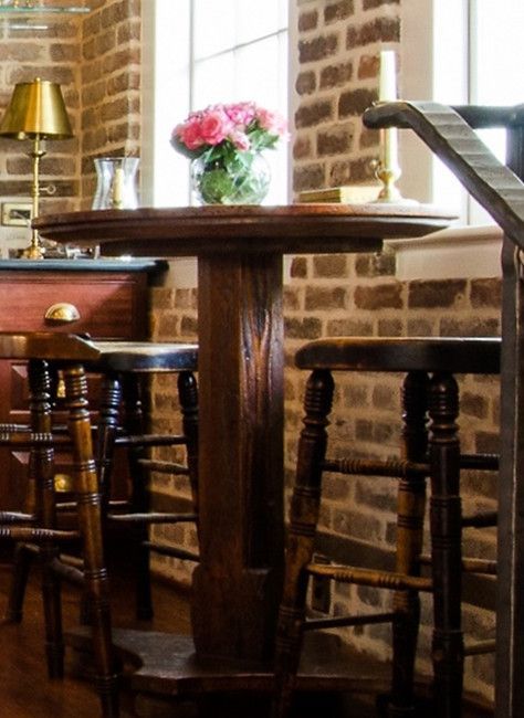 Round wooden table with stools