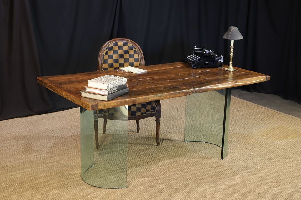 Wooden table with books, chair in background