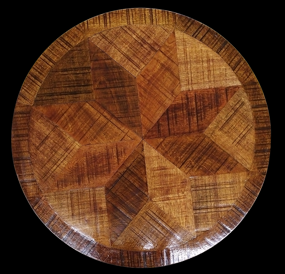 Wooden table top with starburst pattern and circular border